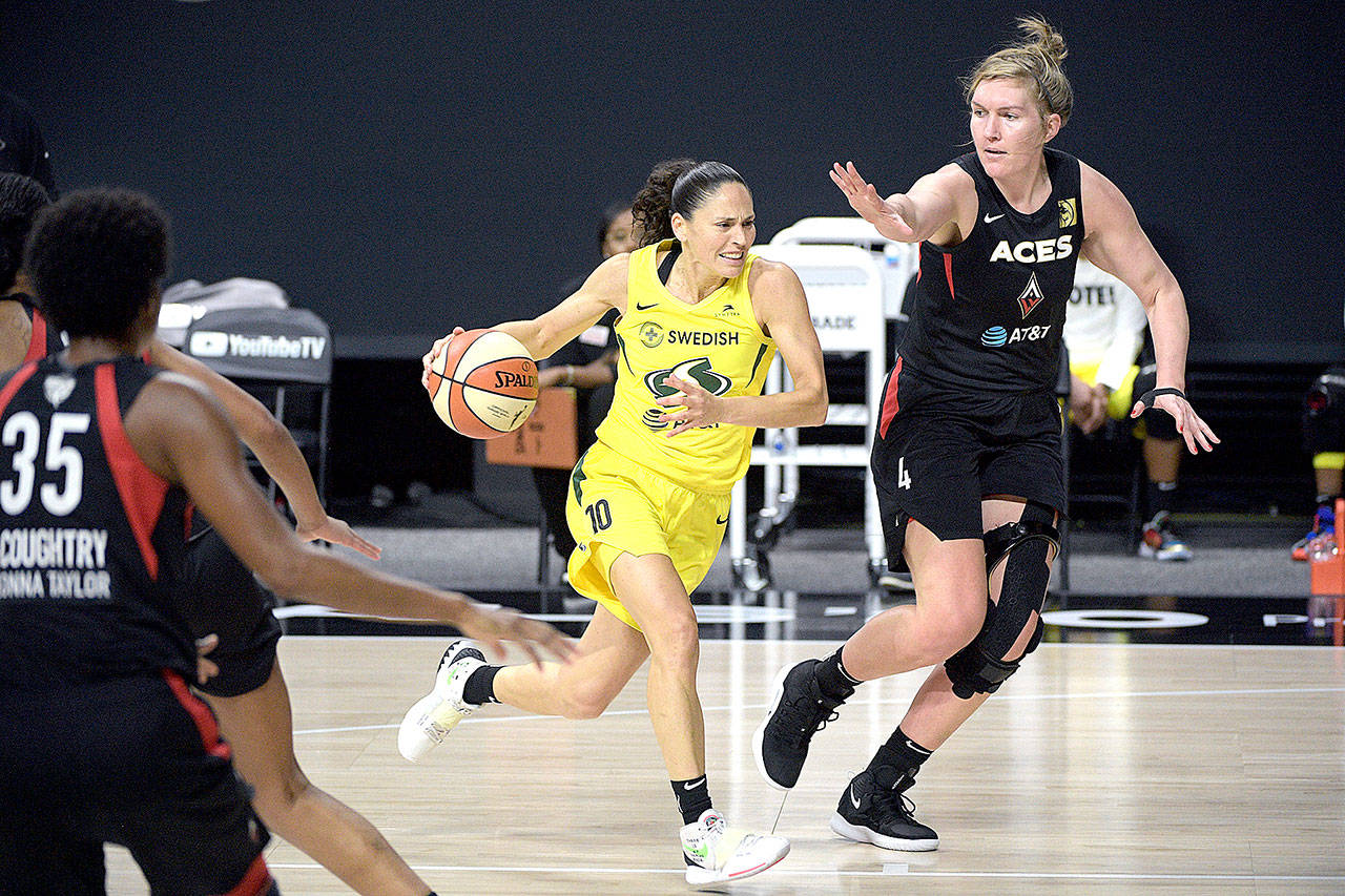 Seattle Storm guard Sue Bird (10) drives to the basket Sunday in front of Las Vegas Aces center Carolyn Swords (4) during Game 2 of the WNBA Finals in Bradenton, Fla. (Phelan M. Ebenhack/Associated Press)