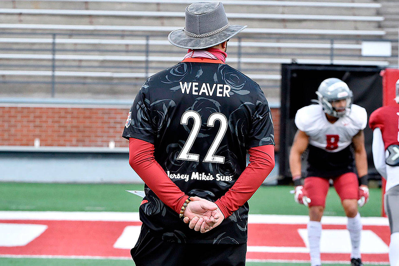 Washington State football coach Nick Rolovich wearing the jersey of Portland Thorns forward and former Cougars' women's soccer standout Morgan Weaver during a scrimmage Saturday. (Washington State University)