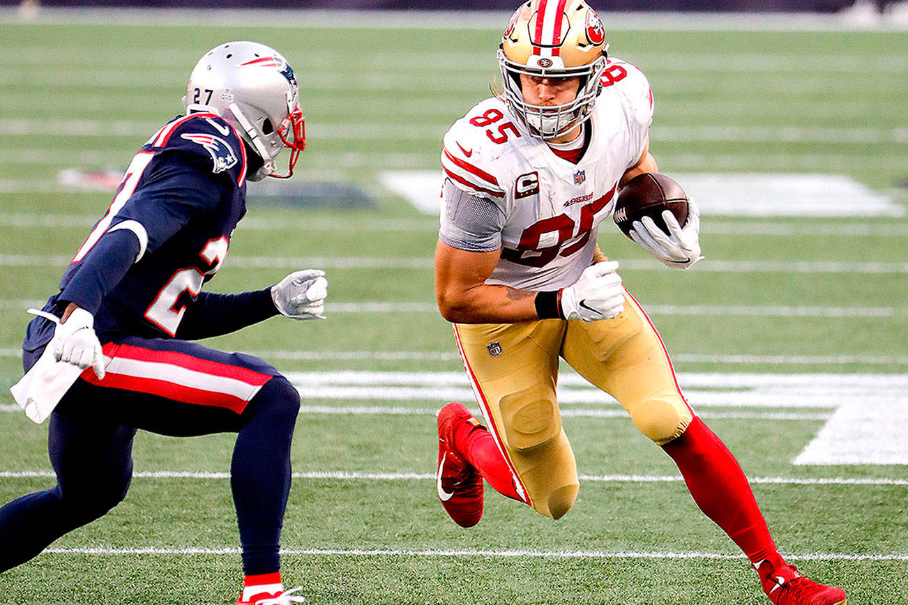 San Francisco 49ers tight end George Kittle runs the ball after a catch against the New England Patriots during an NFL football game at Gillette Stadium, Sunday, Oct. 25, 2020 in Foxborough, Mass. (Winslow Townson/AP Images for Panini)