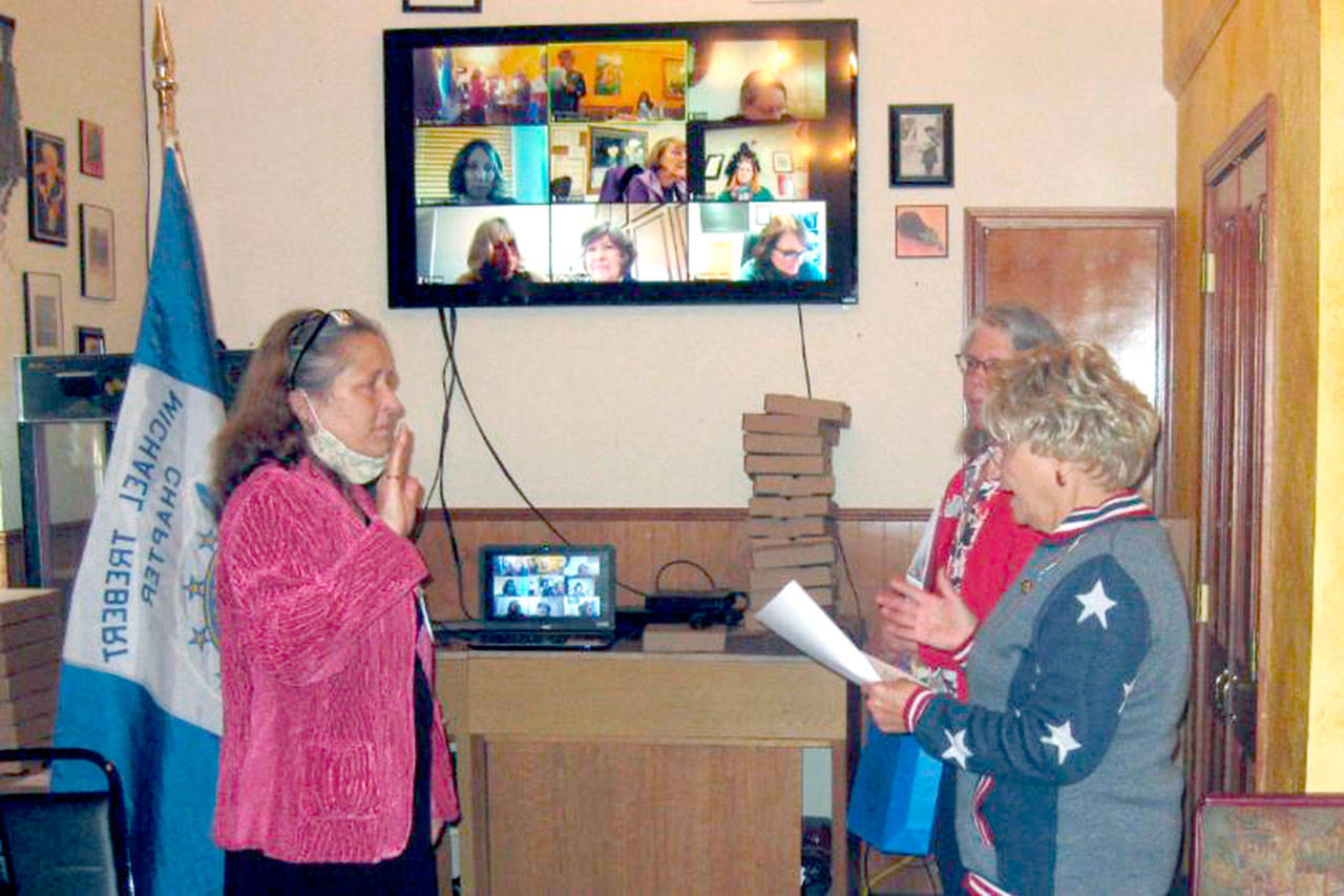 Pictured is Cynthia Bork, on left, being sworn in by Carol Weiler, also shown is Virginia Wagner.