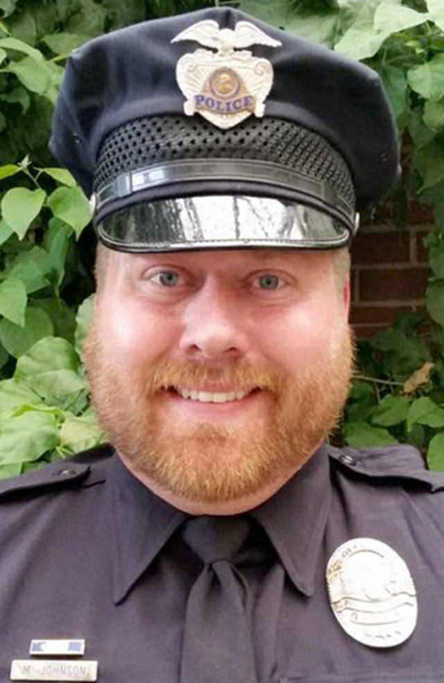 Off-duty Port Angeles police officer Mike Johnson on Sunday helped two security officers detain a belligerent Casey Strege, of Eugene, Ore., outside the entrance of the Independent Bible Church in Port Angeles until on-duty police arrived. (Courtesy photo)