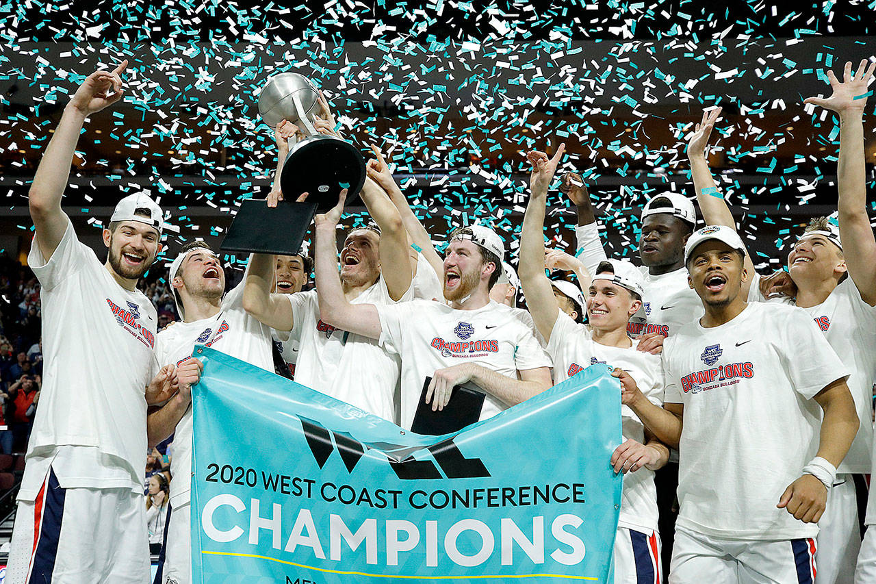 Gonzaga players celebrate after defeating Saint Mary’s at the final of the West Coast Conference men’s tournament in Las Vegas on March 10, 2020, file photo. Gonzaga will begin the college basketball season No. 1 for the first time after coach Mark Few’s bunch earned 28 first-place votes in the preseason AP Top 25 poll released Monday. (John Locher/Associated Press