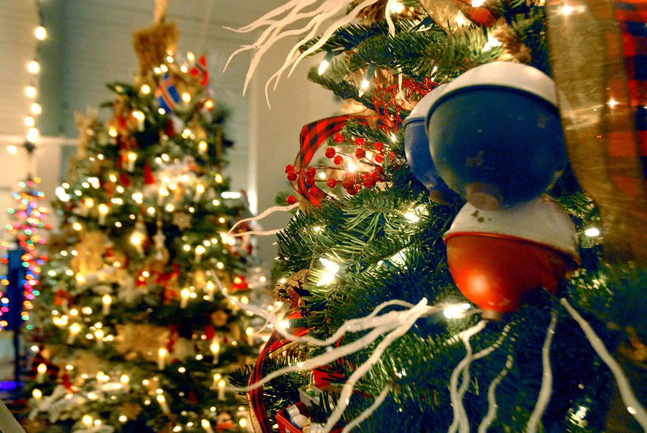 Lights and decorations adorn a tree on display at the 2019 Festival of Trees event in Port Angeles. This year’s event has been reorganized into a trio of fundraising events presented in a part virtual, part in-person format. (Keith Thorpe/Peninsula Daily News file)