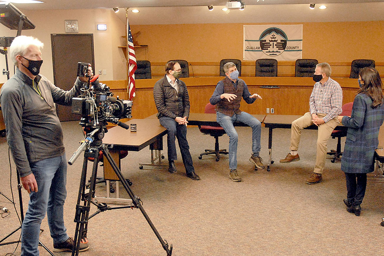 Keith Thorpe/Peninsula Daily News
Clallam County commissioners, from center left, Bill Peach, Mark Ozias and Randy Johnson take part in an interview with ABC correspondent Zohreen Shah as cameraman Glenn Aust films the proceeding on Friday at the Clallam County Courthouse in Port Angeles.