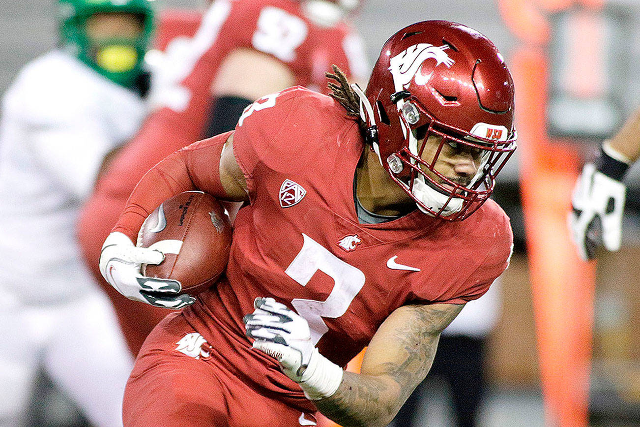 Washington State running back Deon McIntosh (3) carries the ball during the second half of an NCAA college football game against Oregon in Pullman, Wash., Saturday, Nov. 14, 2020. Oregon won 43-29. (AP Photo/Young Kwak)