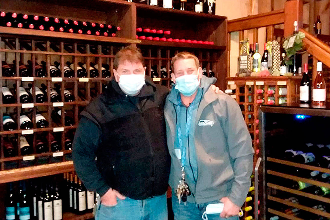 Pierre LaBossiere/Peninsula Daily News
From left, Kokopelli Grill owner Michael McQuay and general manager Brian Jennings prepare to close to dine-in to comply with Gov. Jay Inslee's recent update to COVID-19 restrictions.