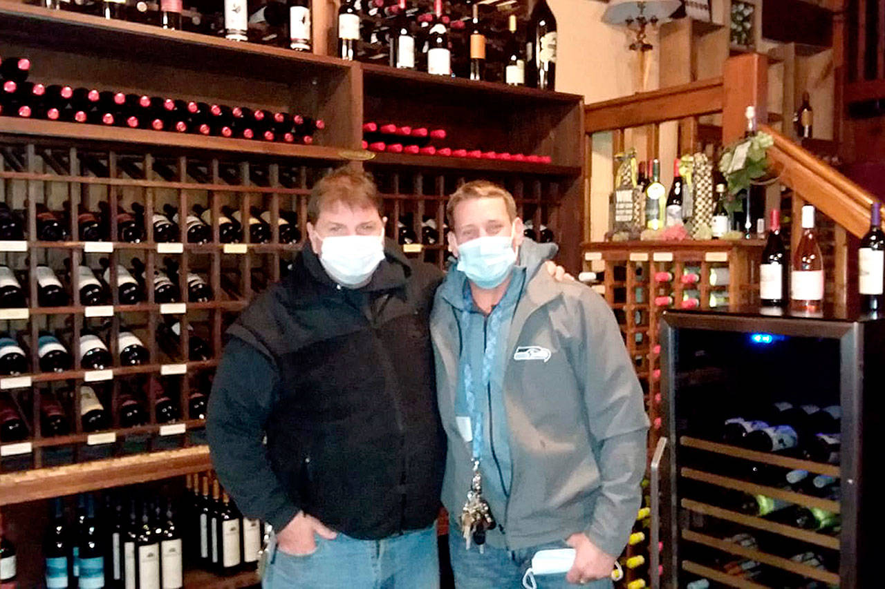 Pierre LaBossiere/Peninsula Daily News From left, Kokopelli Grill owner Michael McQuary and general manager Brian Jennings prepare to close to dine-in to comply with Gov. Jay Inslee’s recent update to COVID-19 restrictions.