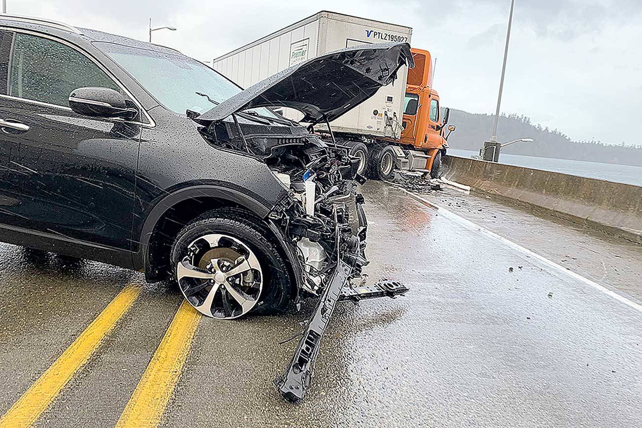A head-on collision between a car and semi-truck closed the Hood Canal Bridge in both directions for nearly two hours on Tuesday morning.  (State Patrol)