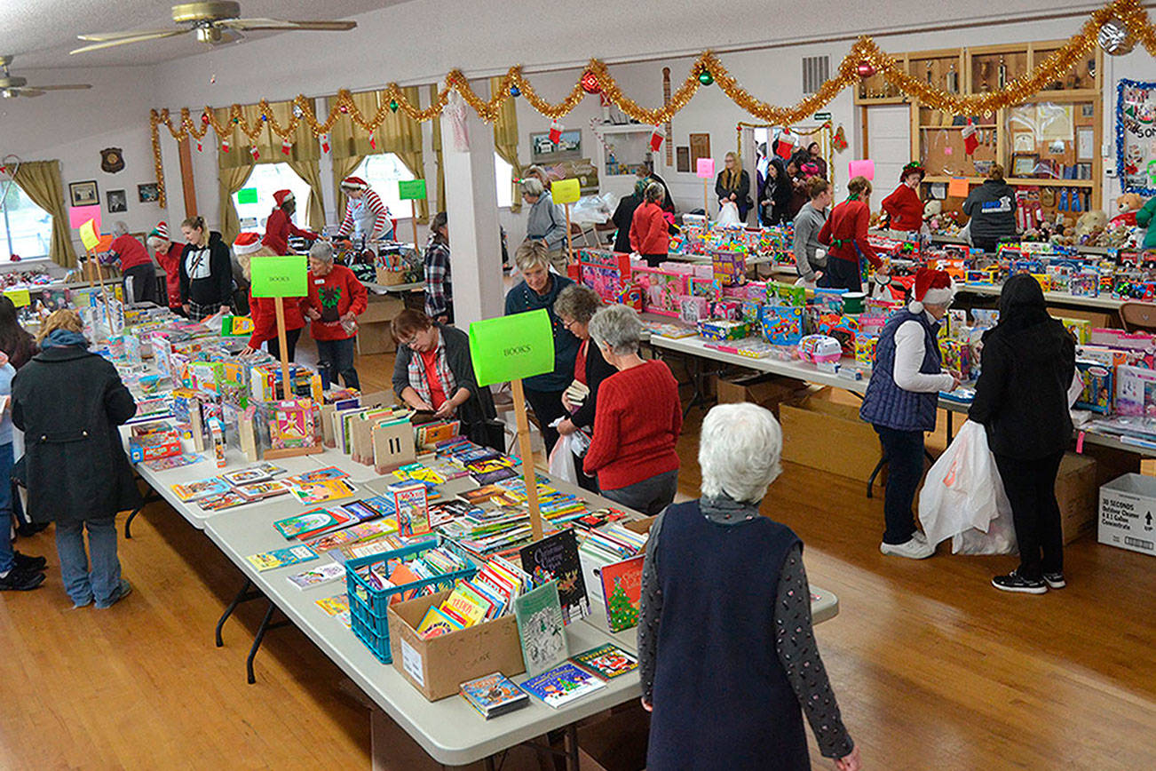 Toys for Sequim Kids continues this year on Dec. 9 at the Sequim Prairie Grange with masks required for volunteers and families. Toy and donation sites are setup at several Sequim locations. Last year, the event provided gifts for 411 children from 140 families in the Sequim area. Sequim Gazette file photo by Matthew Nash