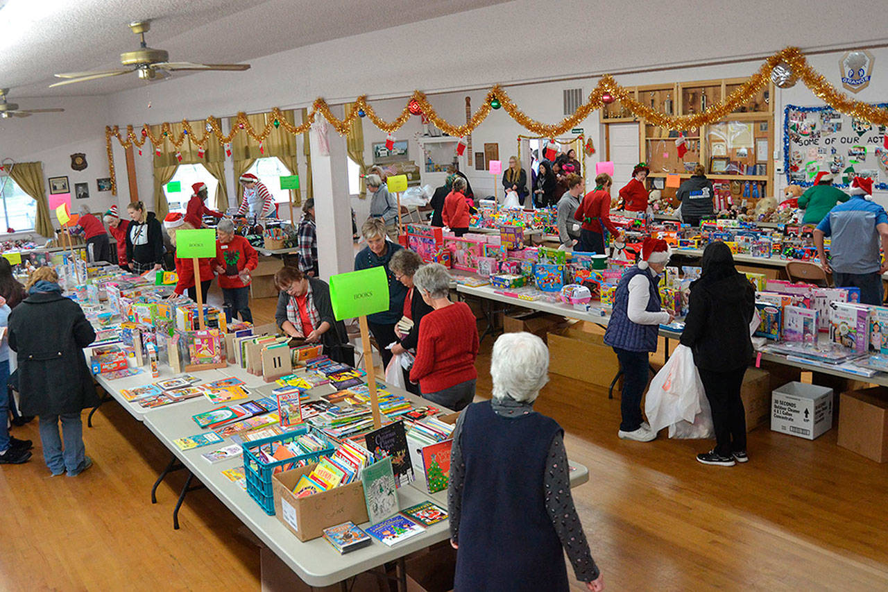 Toys for Sequim Kids continues this year on Dec. 9 at the Sequim Prairie Grange with masks required for volunteers and families. Toy and donation sites are setup at several Sequim locations. Last year, the event provided gifts for 411 children from 140 families in the Sequim area. (Sequim Gazette file photo by Matthew Nash)