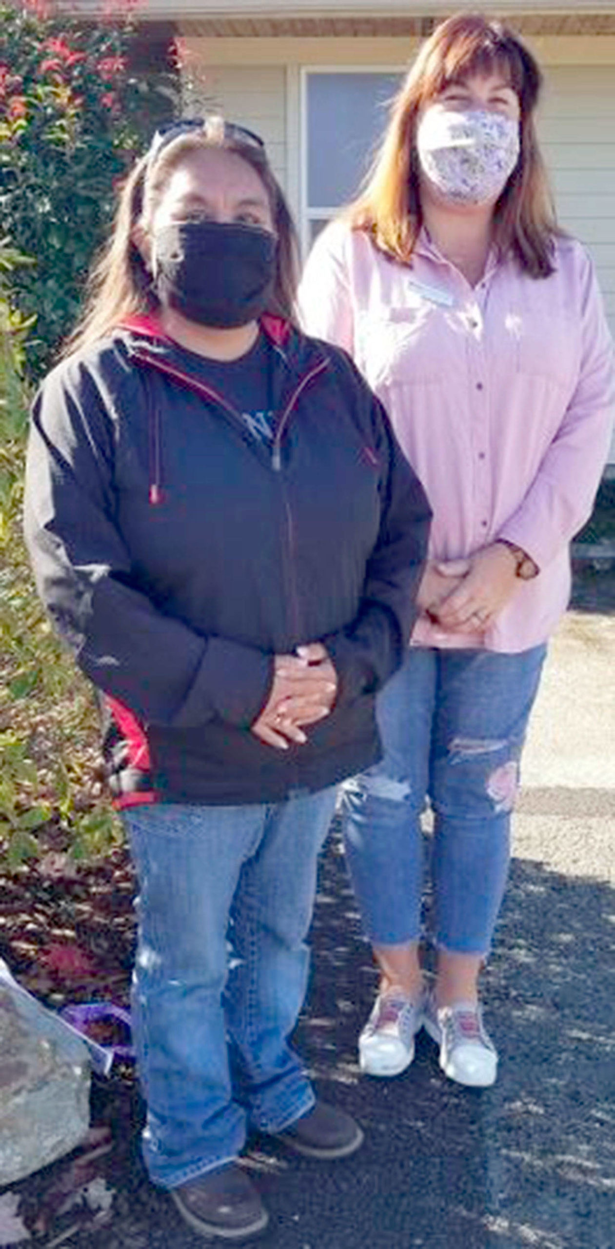 New homeowner Lana Sampson poses with Colleen Robinson from Habitat for Humanity of Clallam County.