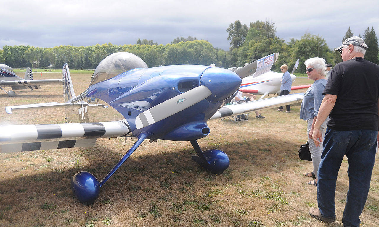 Margie and Stan Oserbauer of Sequim get a close-up look at a 2009 RV4 owned by Rick Stoffel of Sequim at the Olympic Peninsula Air Affaire and Sequim Valley Fly-In in 2019. (Michael Dashiell/Sequim Gazette file)
