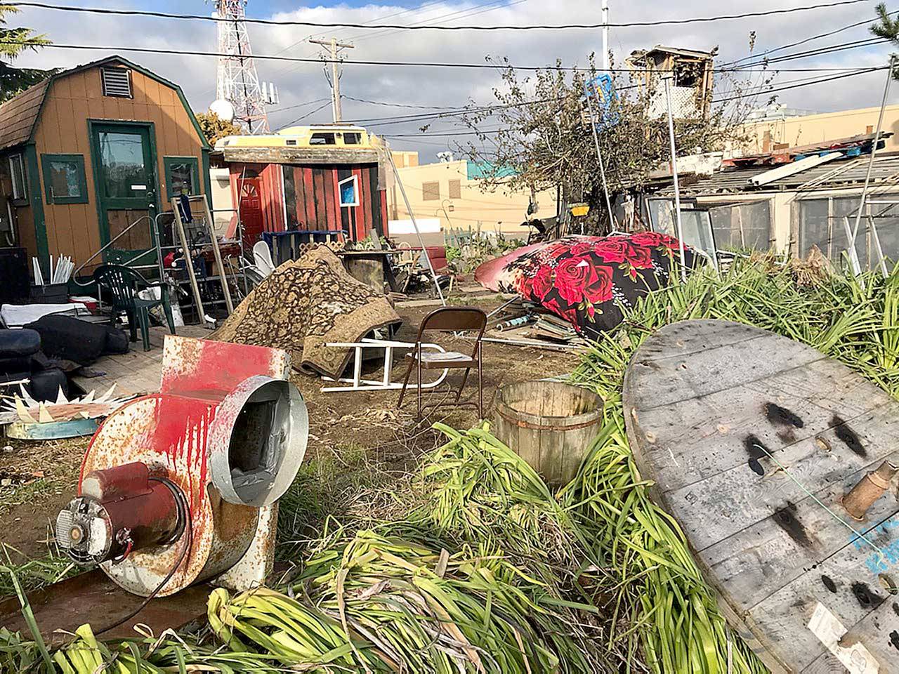 Former Clallam County Superior Court Judge Brian Coughenour is avoiding further code enforcement action by making satisfactory efforts to clean up his property along East Fifth Street in Port Angeles, according to city officials. (Paul Gottlieb/Peninsula Daily News)