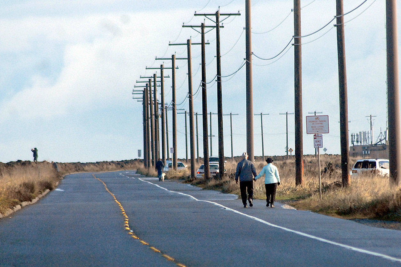 Pedestrians take advantage of a break in the rain to take a stroll along the Waterfront Trail along Ediz Hook in Port Angeles on Wednesday. Fair conditions are expected for the rest of the week on the North Olympic Peninsula, although showers are expected to return on Saturday. (Keith Thorpe/Peninsula Daily News)