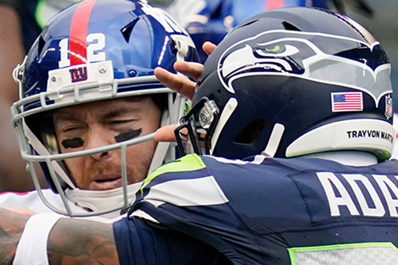 Seattle Seahawks strong safety Jamal Adams (33) sacks New York Giants quarterback Colt McCoy (12) during the first half of an NFL football game Dec. 6 in Seattle. (Elaine Thompson/The Associated Press)