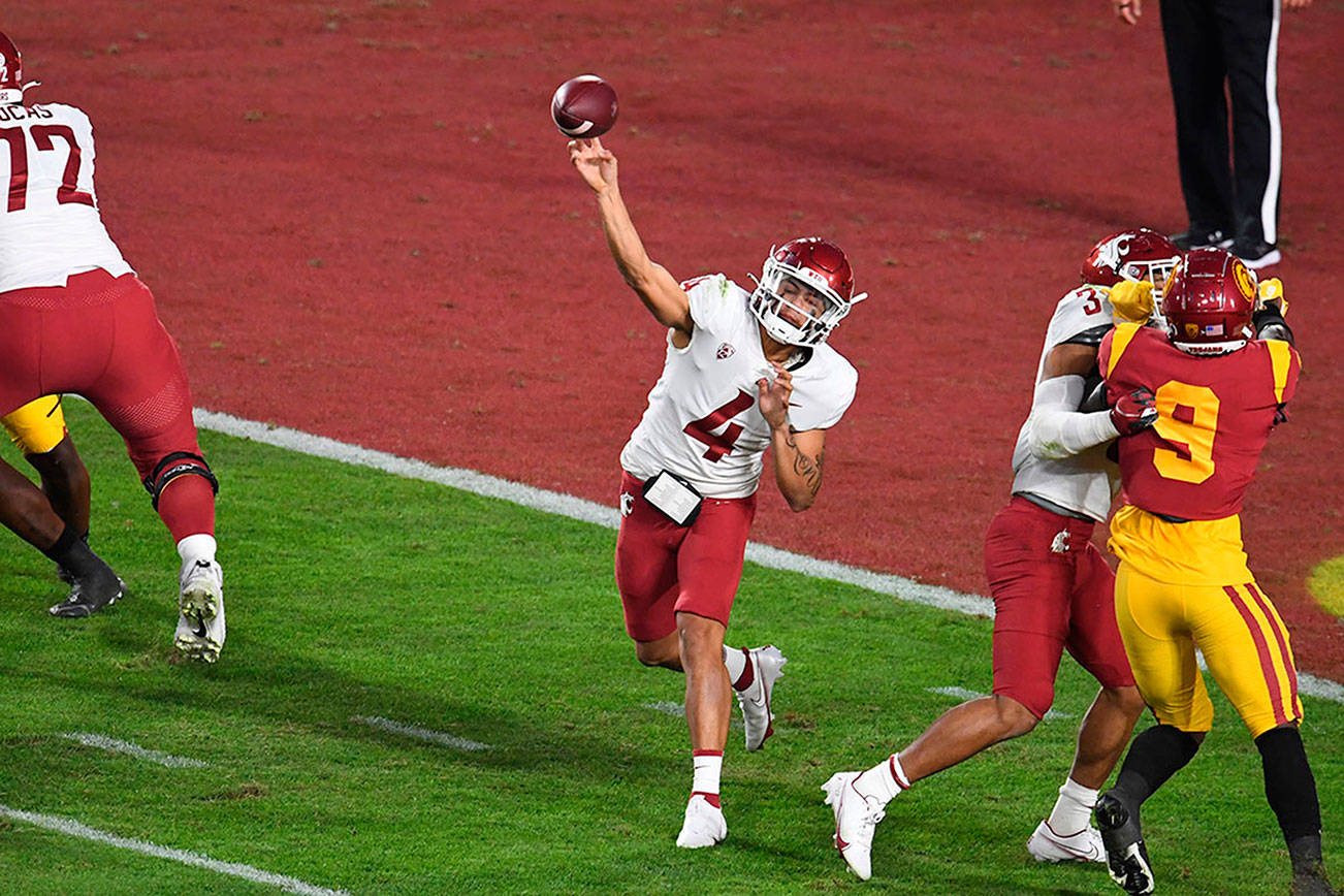 Washington State quarterback Jayden de Laura passes against Southern California in the first half of an NCAA college football game in Los Angeles, Sunday, Dec. 6, 2020. (Keith Birmingham/The Orange County Register via AP)