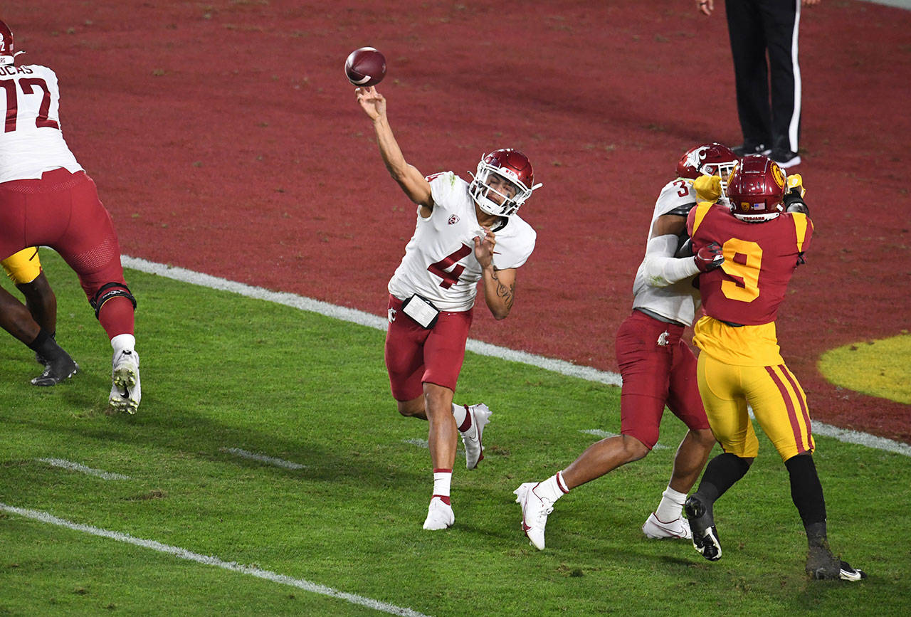 Washington State quarterback Jayden de Laura passes against Southern California in the first half of an NCAA college football game in Los Angeles on Sunday, Dec. 6, 2020. (Keith Birmingham/The Orange County Register via AP)