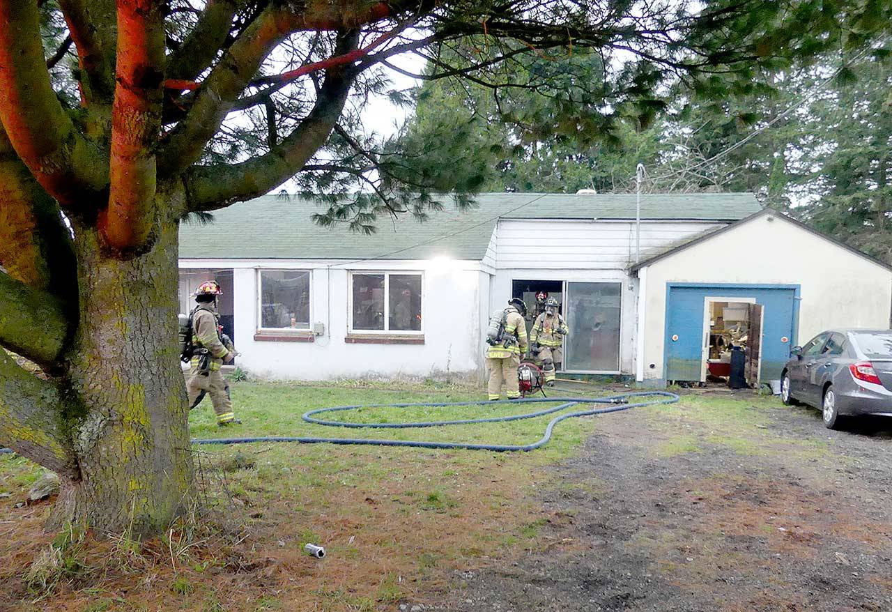 East Jefferson Fire Rescue personnel used a fire extinguisher to put out a fire in a small room inside a Port Hadlock home Saturday, Dec. 19, 2020. (East Jefferson Fire Rescue)