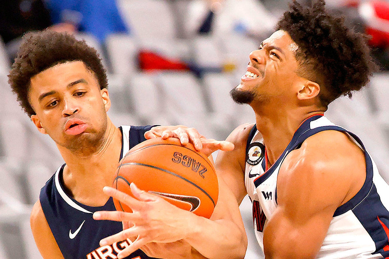 Virginia guard Jabri Abdur-Rahim (1) and Gonzaga guard Aaron Cook (4) wrestle for control of the ball during the second half of an NCAA college basketball game Saturday, Dec. 26, 2020, in Fort Worth, Texas. Gonzaga won 98-75. (AP Photo/Ron Jenkins)