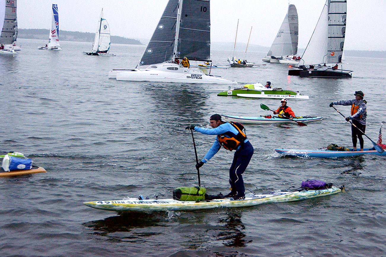 Paddle boarder Luke Burritt of team Fueled on Stoke takes off at the start of the Race to Alaska in 2017.
