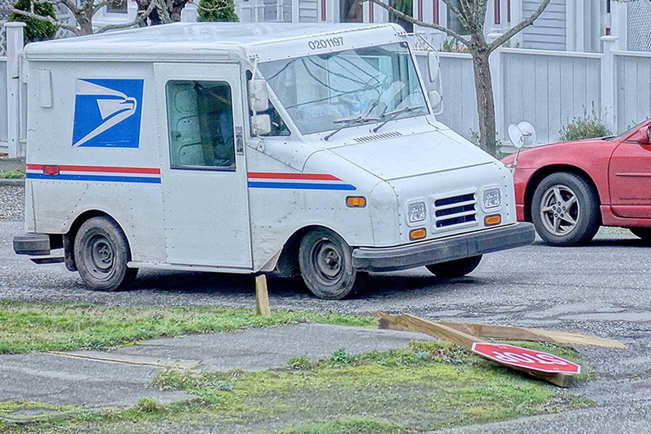 Wind snapped a stop sign post at Lawrence and Van Buren streets on Wednesday in Uptown Port Townsend. The powerful gusts knocked power out for nearly 1,000 Jefferson Public Utility District customers throughout the morning. (Diane Urbani de la Paz/Peninsula Daily News)