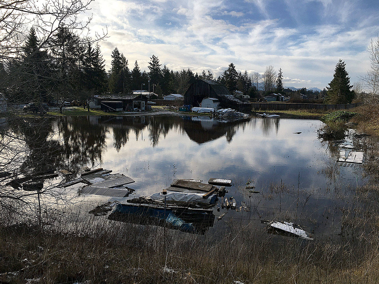 Portions of Seventh Avenue, including the 900 block of South Seventh Avenue, saw flooding from heavy rains, blocked storm drains and/or flooded stormwater ponds on Dec. 21. (Matthew Nash/Olympic Peninsula News Group)