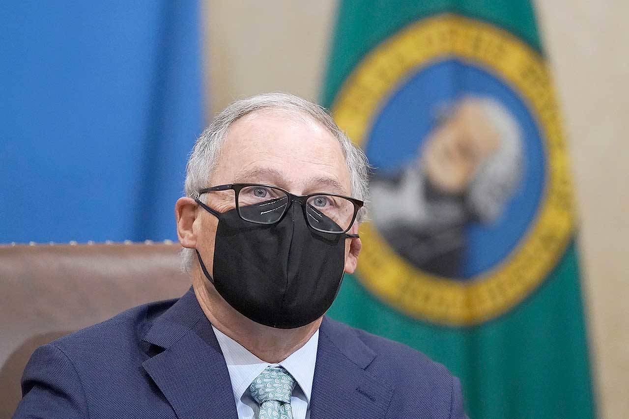 Gov. Jay Inslee speaks at a news conference Tuesday at the Capitol in Olympia. Inslee said some COVID-19 restrictions in Washington will be eased beginning next week and the state will change its reopening plan to move from a county-based oversight system to one focused on regions. (Ted S. Warren/The Associated Press)