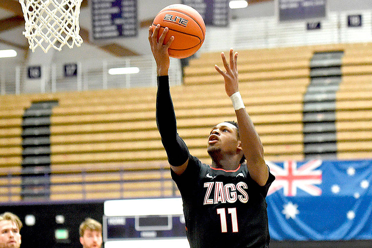 Gonzaga University guard Joel Ayayi, drives to the basket during the first half of an NCAA college basketball game against Portland in Portland, Ore., Saturday, Jan. 9, 2021. (AP Photo/Steve Dykes)