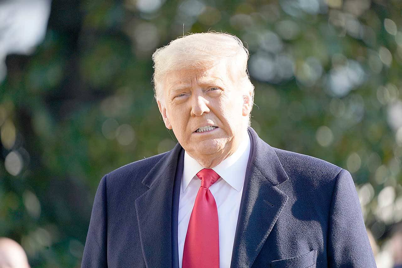 President Donald Trump speaks to the media before boarding Marine One on the South Lawn of the White House on Tuesday in Washington. (Gerald Herbert/The Associated Press)