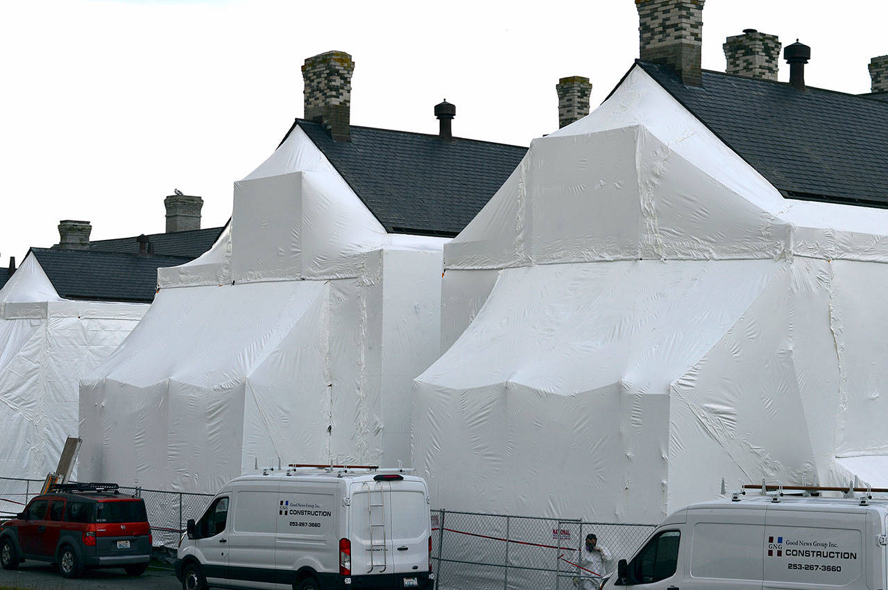While Fort Worden State Park is relatively quiet this winter, two Officers’ Row houses are encased in plastic while their wooden siding is refurbished. The six-month project, funded by Washington State Parks, is expected to be complete by spring. Diane Urbani de la Paz