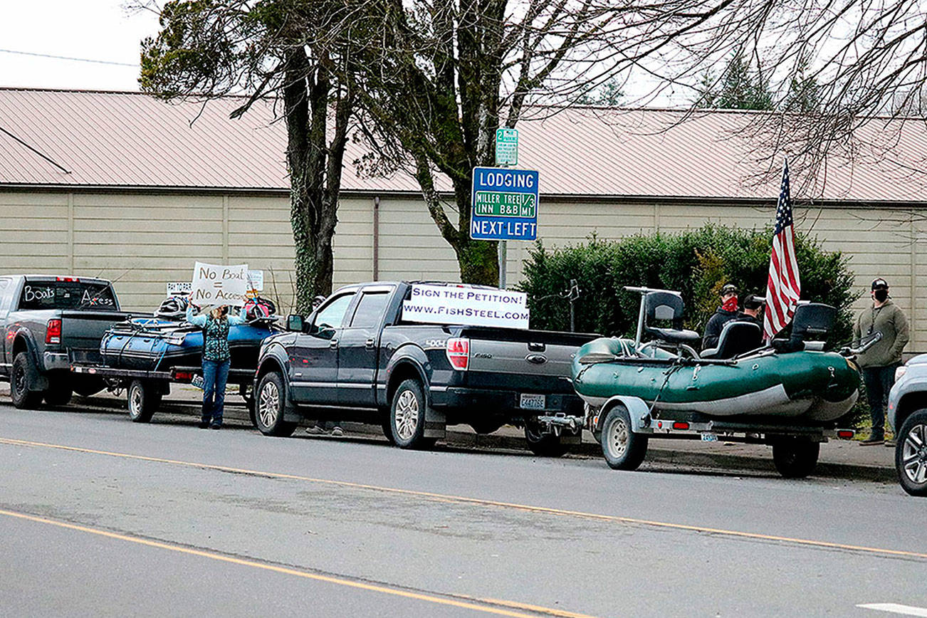Outdoors enthusiasts rallied in Forks last week to protest steelhead fishing restrictions.
