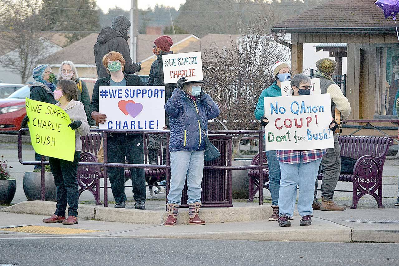 More than 100 community members rallied at the corners of Washington Street and Sequim Avenue on Monday afternoon holding signs to support Sequim City Manager Charlie Bush. The Sequim City Council was set to vote Monday night on Bush’s severance package after a majority of council members voted to call for his resignation on Jan. 11. Members of the group Sequim Good Governance League submitted a petition with 1,239 signatures asking to retain Bush to the city council with more than 680 people designating their city as Sequim, including at least four former Sequim city council members. (Matthew Nash/Olympic Peninsula News Group)