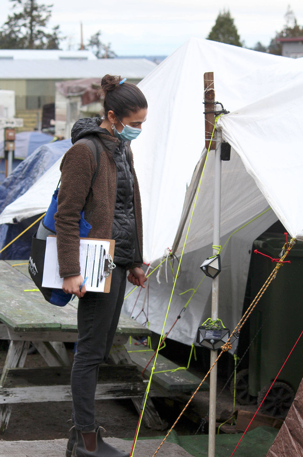 Tirzah Juskalian, COVID Navigator for Olympic Community Action Programs, talks to homeless campers at the Jefferson County Fairgrounds Thursday during the annual Point In Time homeless count. Due to the COVID-19 pandemic, OlyCAP, along with Bayside Housing Services, only used staff to conduct the count, instead of having assistance from volunteers.