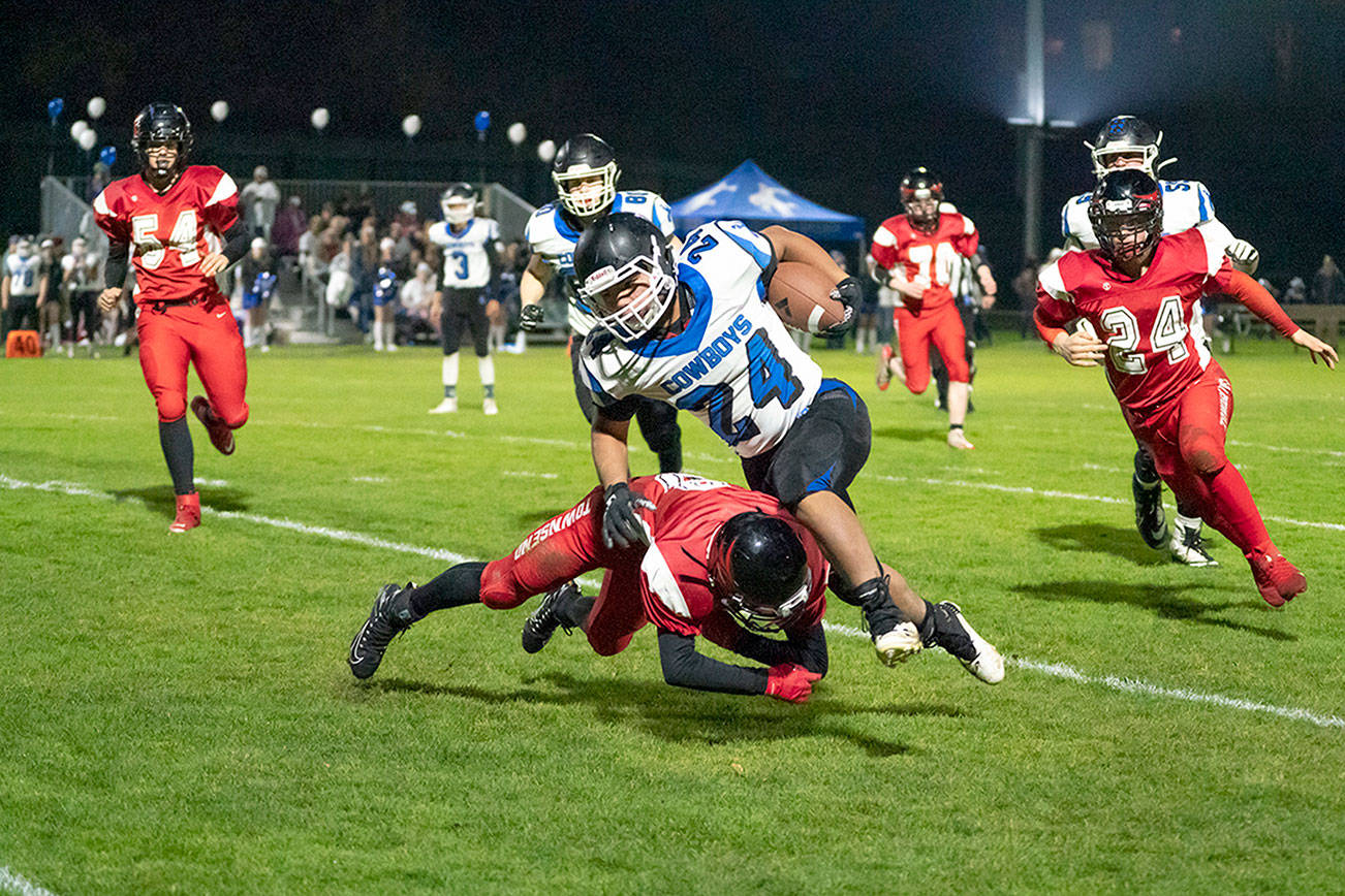 Steve Mullensky/for Peninsula Daily News
Port Townsend's Tanner Woodley upends Chimacum's Anson Jones during the 12th Annual Andy Palmer Classic played in Memorial Field in November 2019. If contests can be played, the two rivals will combine for traditional fall sports for the WIAA's Season 1 schedule.