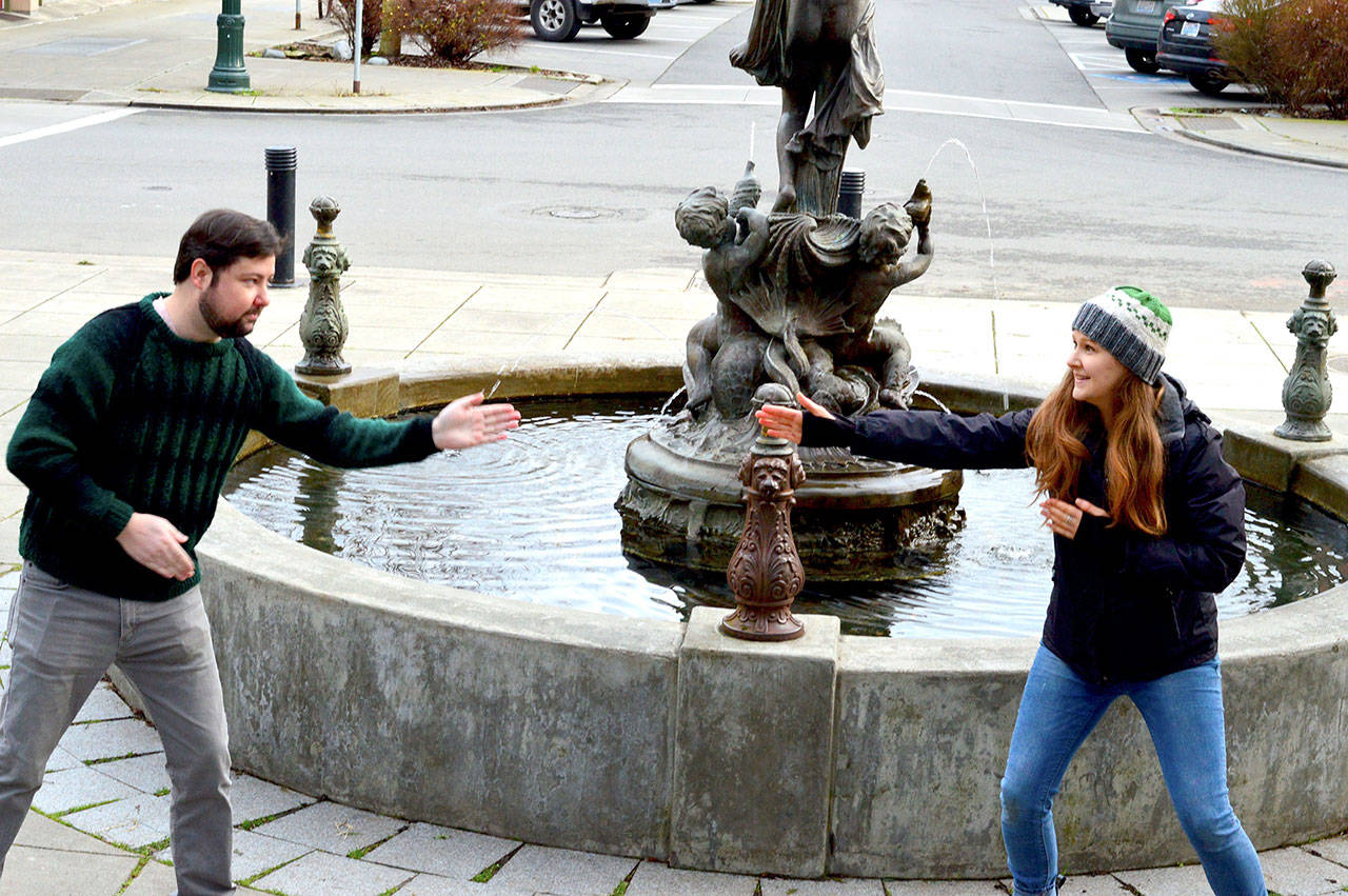 Key City Public Theatre’s Brendan Chambers and Maggie Jo Bulkley engage in a little “zip zap zop,” a theater game, in preparation for their youth theater classes in Port Townsend. The two are not wearing masks in this photo because they live in the same household. (Diane Urbani de la Paz/Peninsula Daily News)