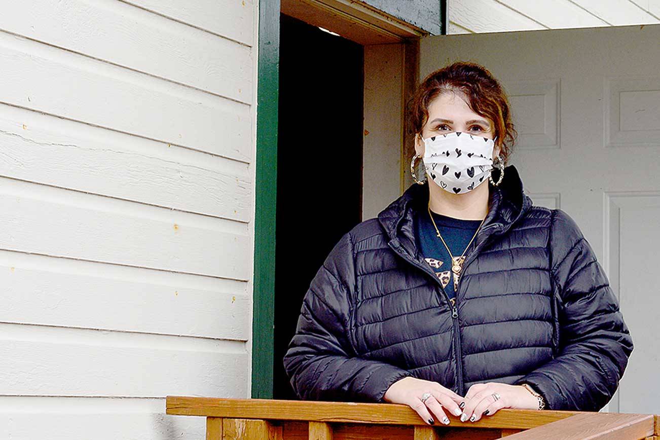 Tri-Area Pharmacy assistant Jennifer Sharko-Taylor helped shepherd patients at Friday's vaccination clinic at the Chimacum Grange. (Diane Urbani de la Paz/Peninsula Daily News)