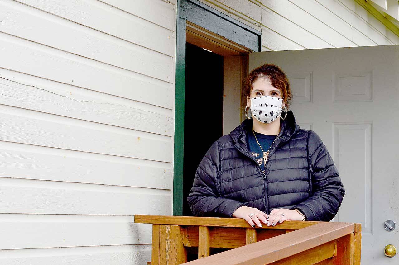 Tri-Area Pharmacy assistant Jennifer Sharko-Taylor helped shepherd patients at Friday’s vaccination clinic at the Chimacum Grange. (Diane Urbani de la Paz/Peninsula Daily News)