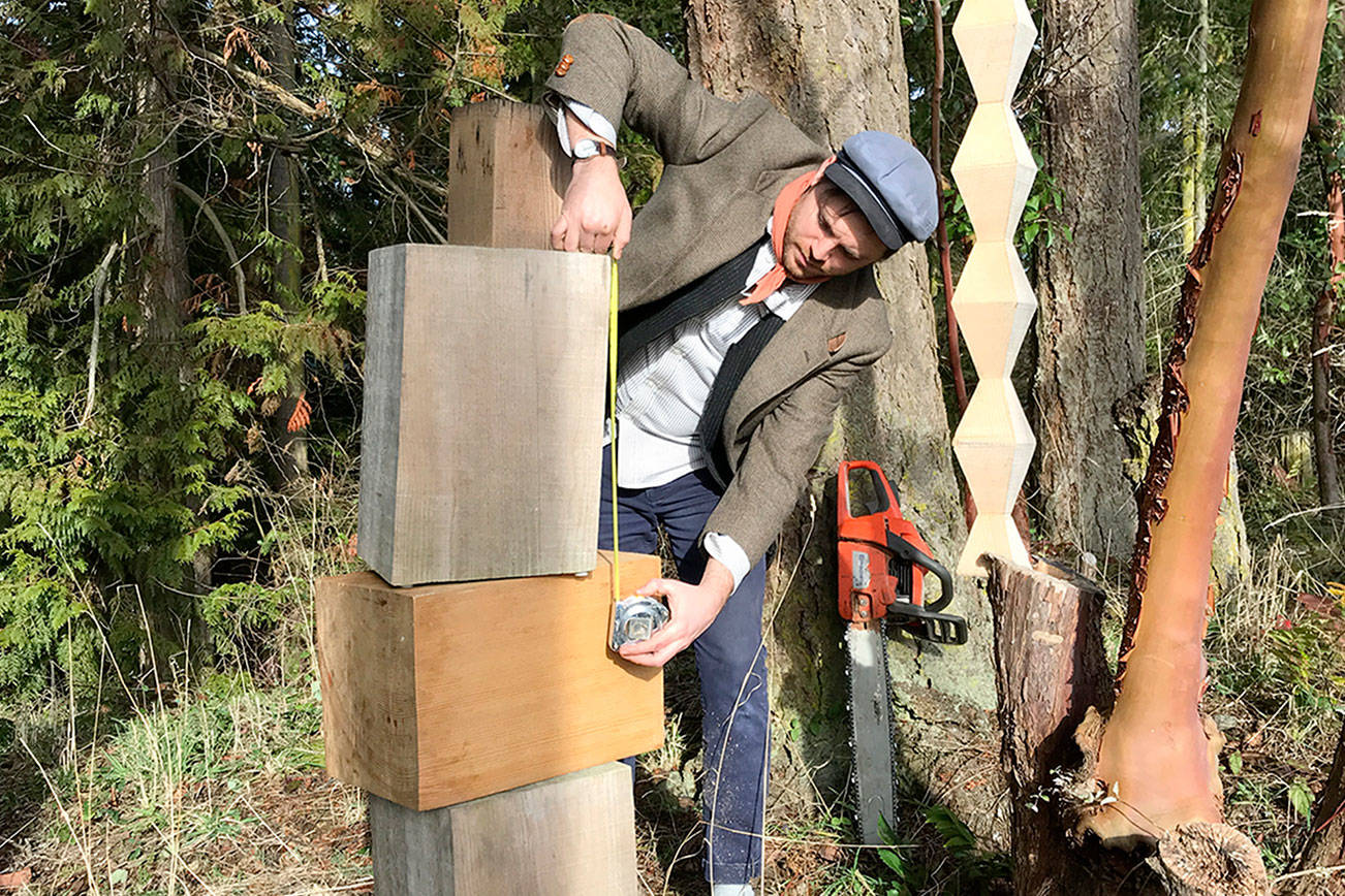 Jonah Trople of Port Townsend, working with wood outside his studio, has been chosen to create sculptural “art markers” for the city’s designated Creative District. (Port Townsend Main Street Program)