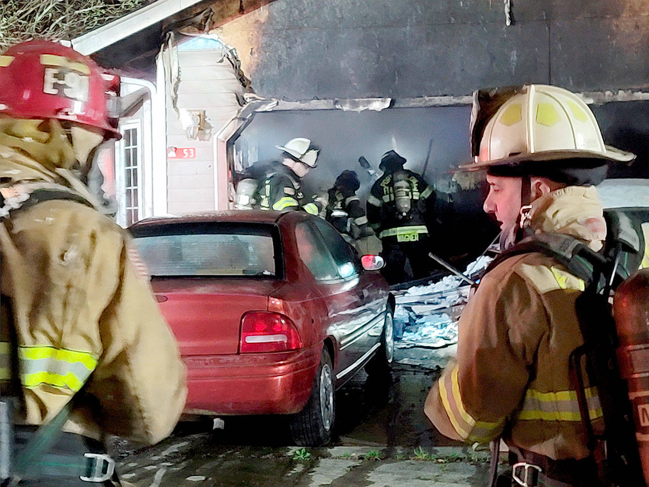 East Jefferson Fire Rescue Firefighters transition from extinguishing the fire to overhaul.