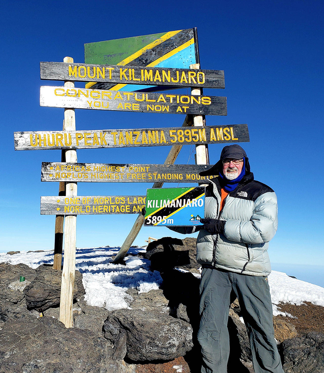 Port Angeles resident Hal Force stands at the summit of Tanzania’s Mount Kilimanjaro (19,341 feet), Africa’s highest peak and the fourth-tallest mountain in the world. (Photo courtesy Hal Force)