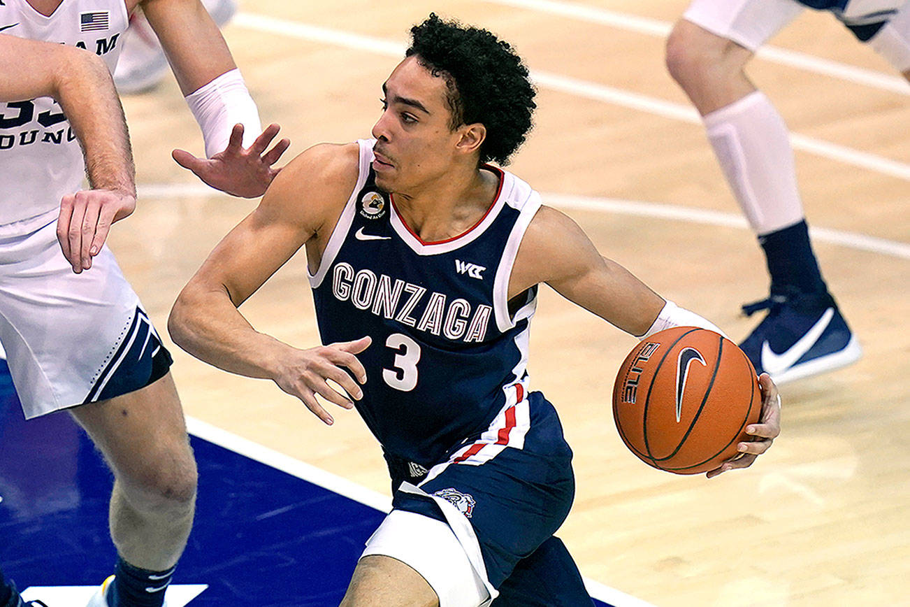 Gonzaga guard Andrew Nembhard (3) drives to the basket in the second half during an NCAA college basketball game against BYU Monday, Feb. 8, 2021, in Provo, Utah. (AP Photo/Rick Bowmer)