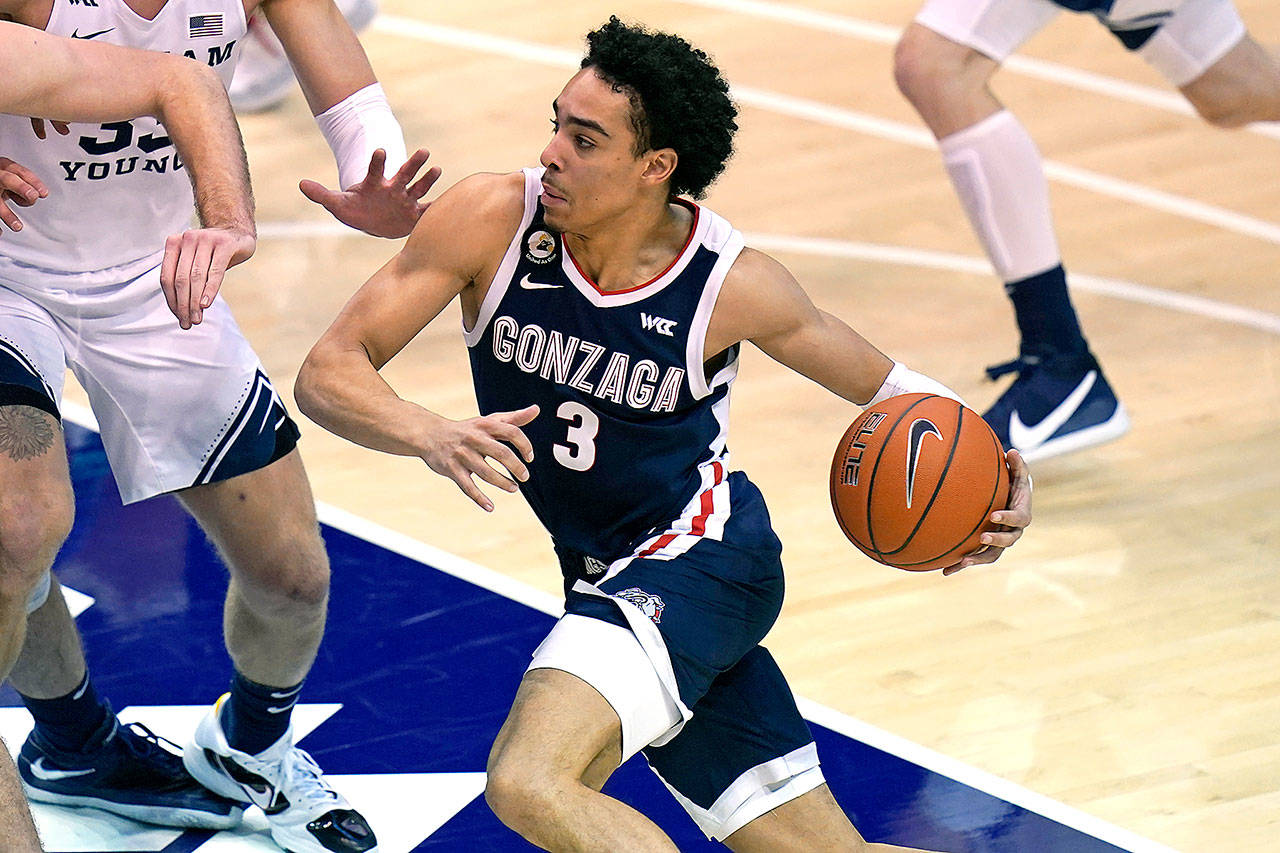 Gonzaga guard Andrew Nembhard (3) drives to the basket in the second half during an NCAA college basketball game against BYU Monday, Feb. 8, 2021, in Provo, Utah. (Rick Bowmer/The Associated Press)