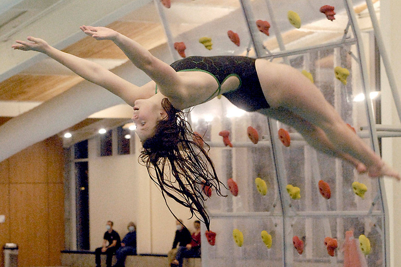Keith Thorpe/Peninsula Daily News
Anne Edwards of Port Angeles takes part in the diving portion of Tuesday's first time trial meet at the Shore Aquatic Center in Port Angeles.