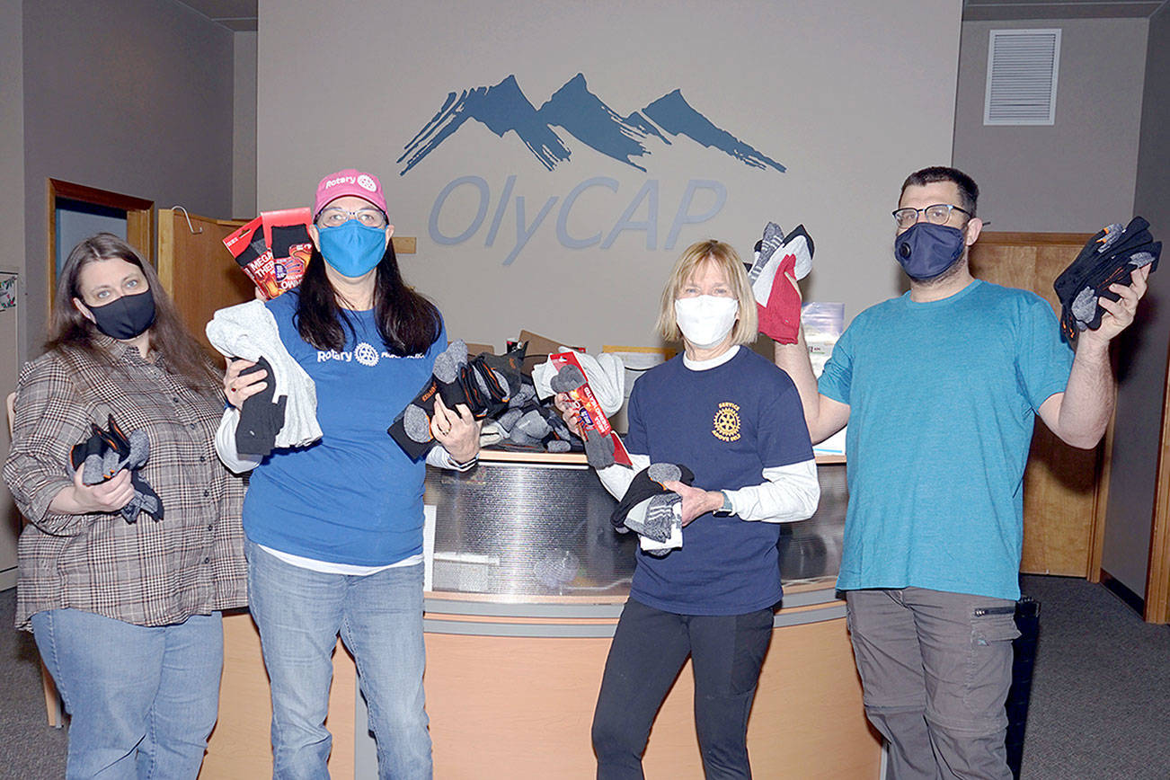 The Port Towsend Sunrise Rotary Club announced that its recent sock drive collected more than 200 pairs of new, warm outdoor sock for distribution to people at need. 

The socks have been donated the Olympic Community Action Program who will oversee their distribution. 

Pictured, from left to right, Cherish Cronmiller, OlyCAP executive director; Jayne Neu, Port Townsend Sunrise Rotary member; Lois Sherwood, Port Townsend Sunrise Rotary Club president; and Sam McCulloch, OlyCAP shelter outreach