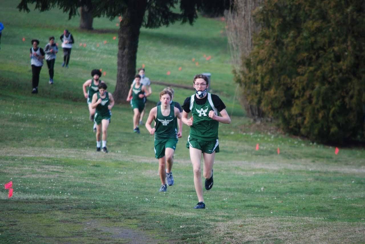 Port Angeles freshman Sam Hayes charges up a hill during a race at Port Townsend Golf Club on Wednesday. Hayes pushed hard and improved his 2-mile time by 15 seconds from the first race of the season. (Rodger Johnson/Port Angeles Cross Country)