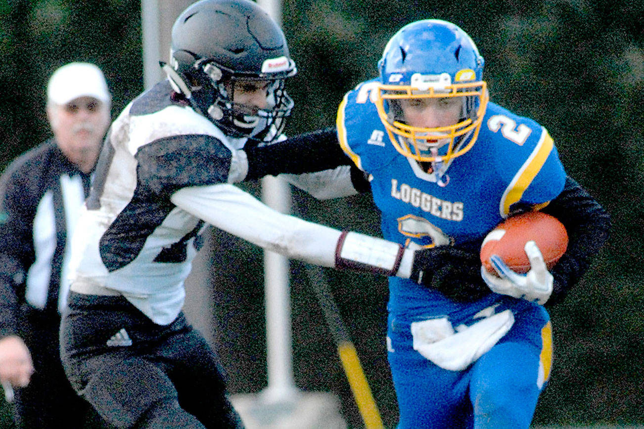 Keith Thorpe/Peninsula Daily News
Crescent's Brenten Dalton, right, tries to evade Lummi Nation's Jaie Leighton during Satuday's matchup in Joyce.