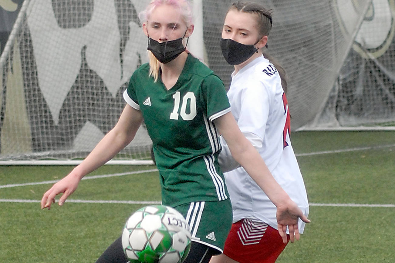 Keith Thorpe/Peninsula Daily News
Port Angeles' Millie Long, left, fends off the defense of East Jefferson's Sorina Johnston during the first half of their Saturday match-up at Peninsula College in Port Angeles.