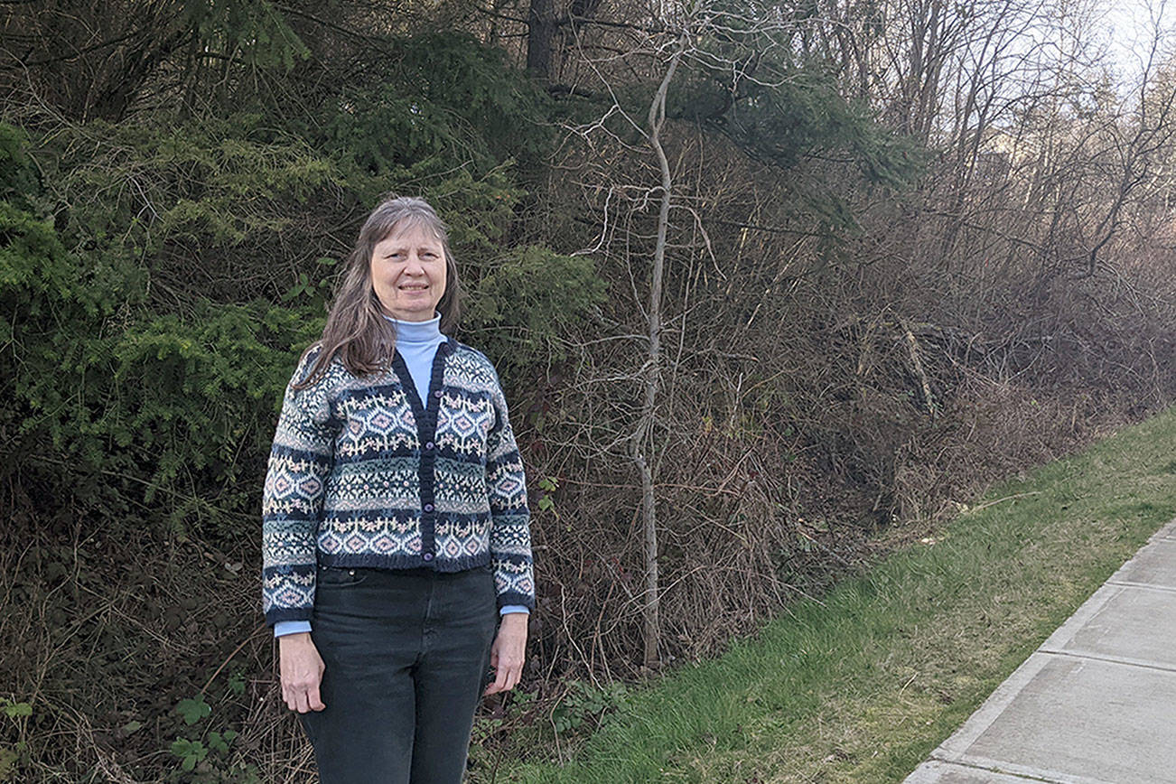 Jaimie Maciejewski, executive director of Habitat for Humanity of East Jefferson County, stands at property destined to be developed for 20 homes on Landes Street in Port Townsend. (Zach Jablonski/Peninsula Daily News)