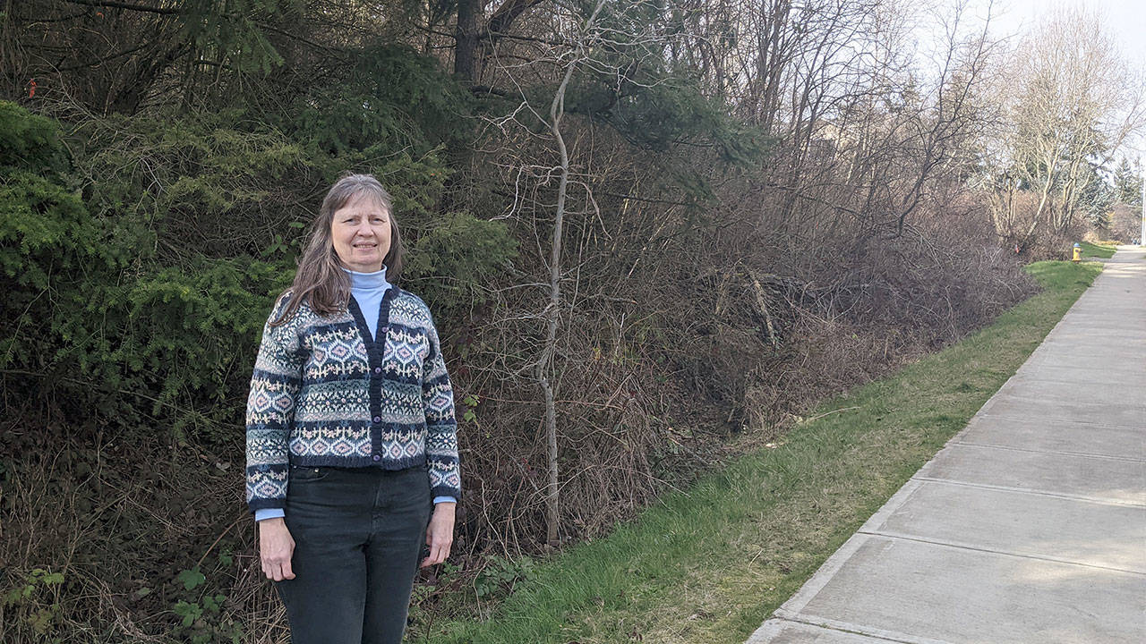 Jaimie Maciejewski, executive director of Habitat for Humanity of East Jefferson County, stands at property destined to be developed for 20 homes on Landes Street in Port Townsend. (Zach Jablonski/Peninsula Daily News)
