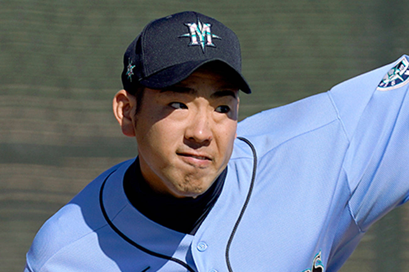 Seattle Mariners pitcher Yusei Kikuchi throws during baseball spring training Thursday, Feb. 25, 2021, in Peoria, Ariz. (Charlie Riedel/The Associated Press)